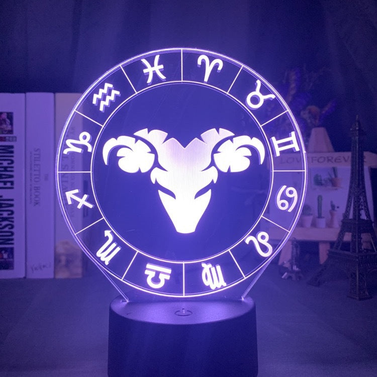 Aries ram engraved on the acrylic zodiac night light, lit purple on its black base