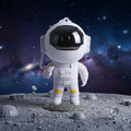 The astronaut galaxy projector unlit on a white background, showing the visor lens